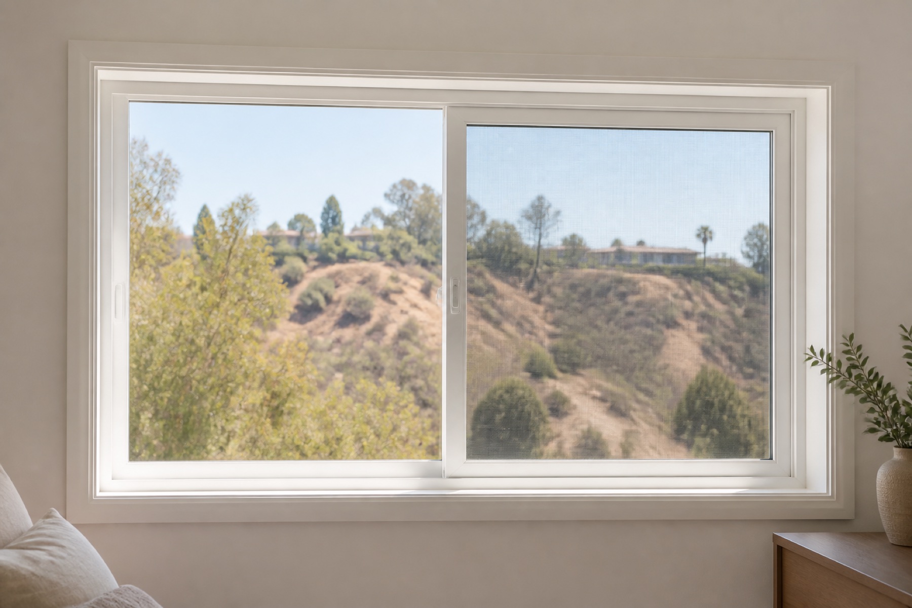 White horizontal sliding window with one panel open toward a Los Angeles hillside