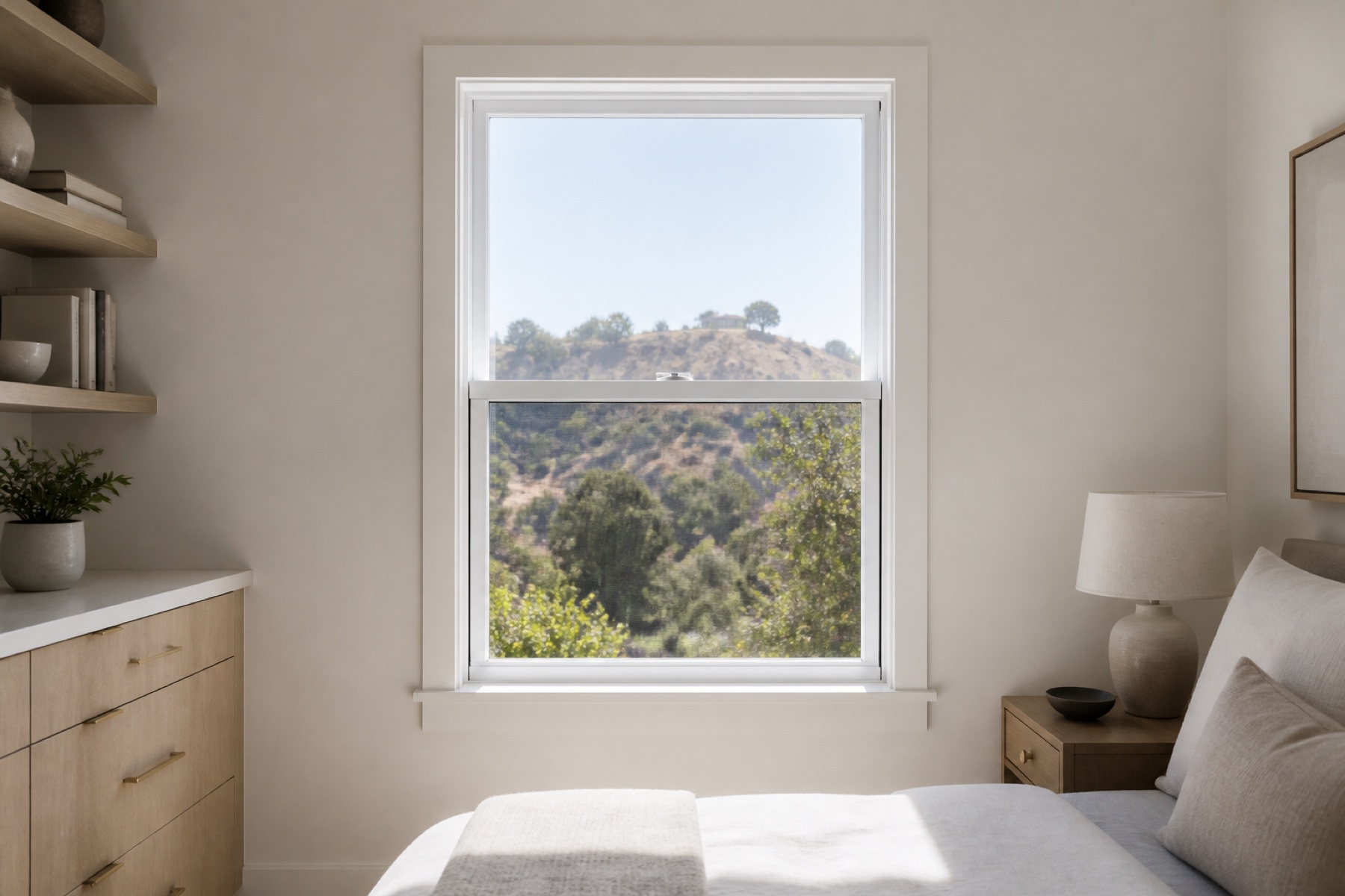 White vinyl single-hung window with the lower sash raised